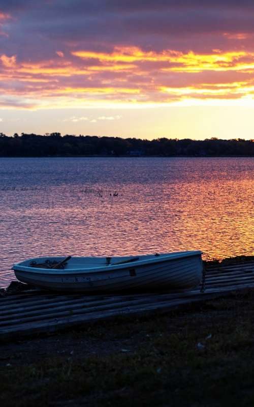 sunset at the lake and a boat500x800